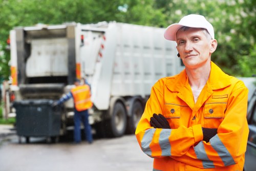 Garbage truck collecting waste in Greenwich residential area